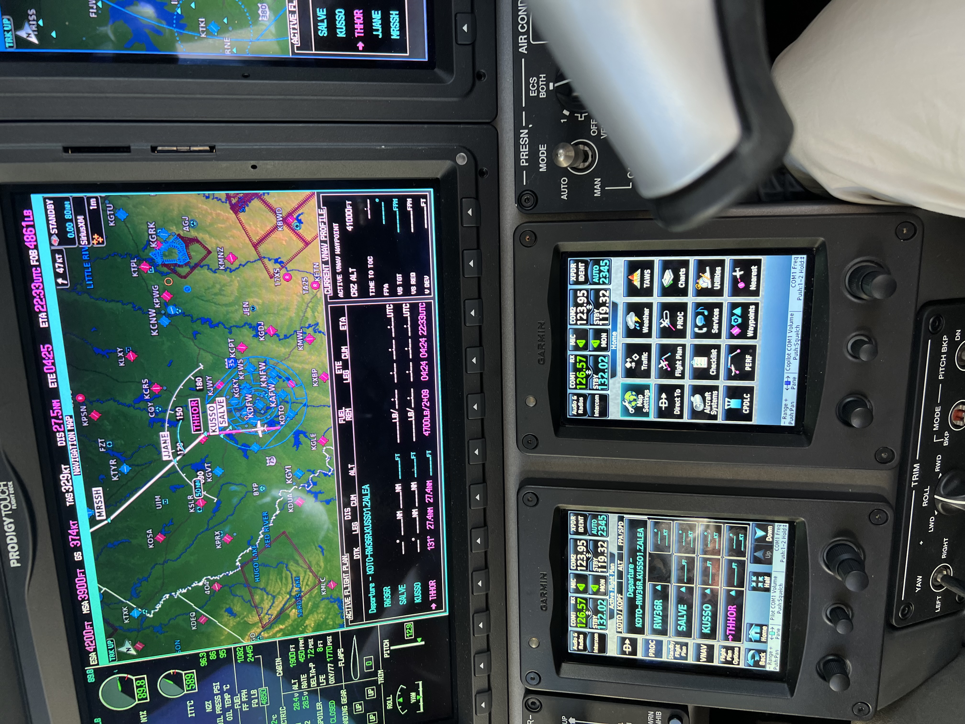Garmin Prodigy Touch avionics showing route, frequencies, and systems